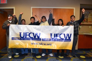UFCW Local 371 Cosmo’s workers celebrate signing their first contract that increases wages, and improves job security.