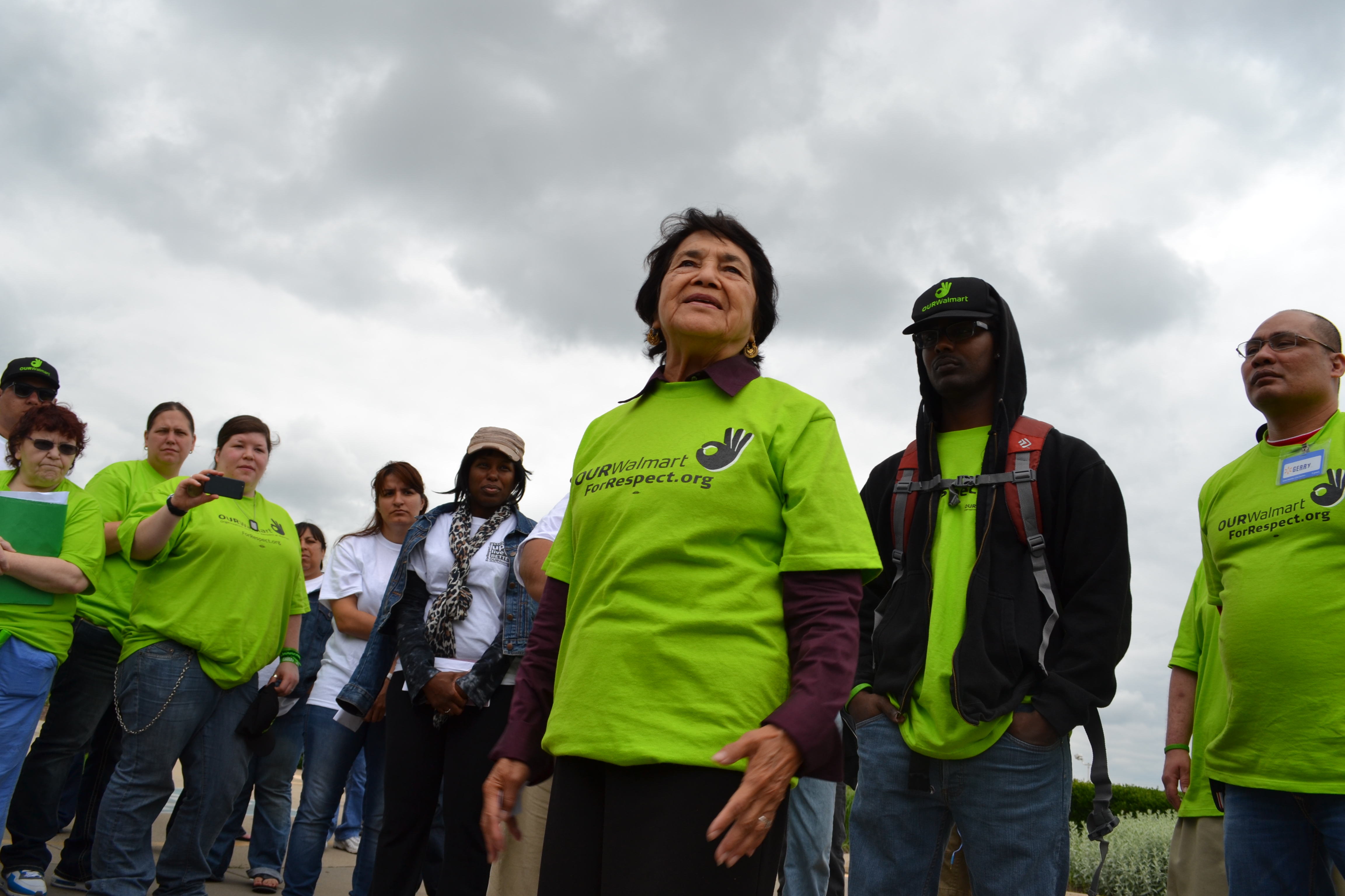Dolores Huerta, standing with OUR Walmart members and workers during the Ride for Respect in summer 2013.