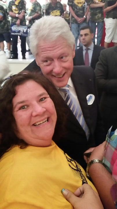 Amy, shown here with former President Clinton while she was representing UFCW Local 227 at a rally