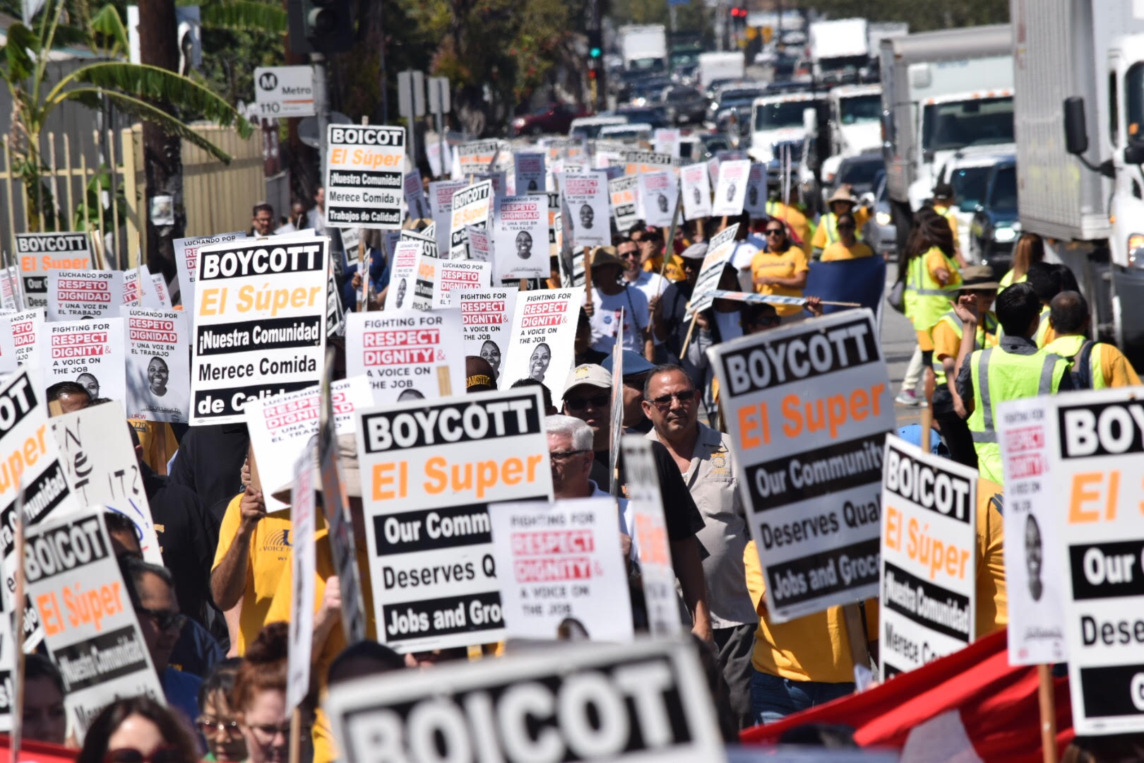 Crowd carries "Boycott El Super" signs