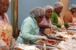 UFCW Local 342 member serve food to hungry community members