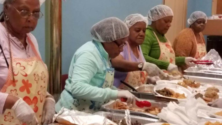 UFCW Local 342 member serve food to hungry community members