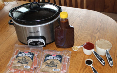 Cocktail Smokies and other ingredients next to a crockpot