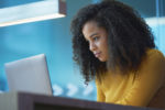 young woman on laptop in office