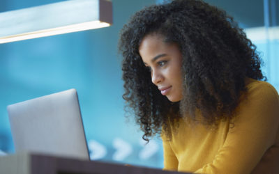 young woman on laptop in office