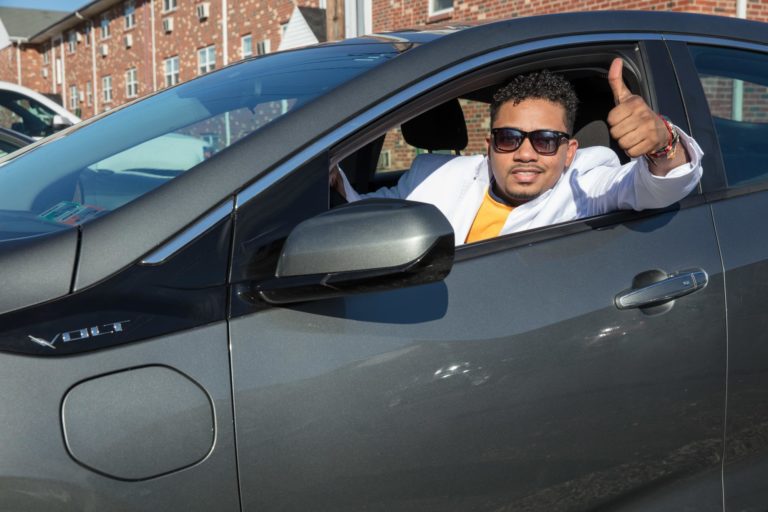 UFCW member in a car gives a thumbs up