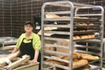 Metro Market worker stands in the bakery at her store