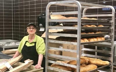 Metro Market worker stands in the bakery at her store