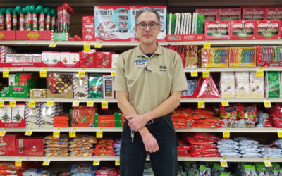 Rick Phelps stands in front of grocery store shelves