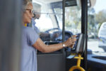Woman uses her phone to pay her bus fare