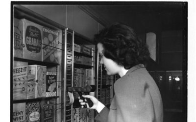 Black and white photo of a woman shopping at Keedoozle