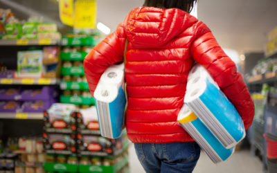 Customer shopping with toilet paper under their arms