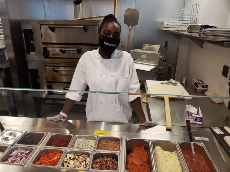 Apraisja Gee at work behind the deli counter