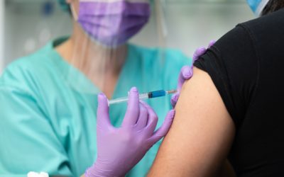 Nurse Vaccinating Man