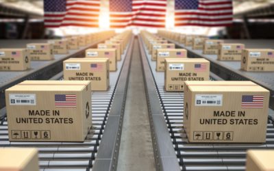 Made in USA United States. Cardboard boxes with text made in USA and american flag on the roller conveyor.