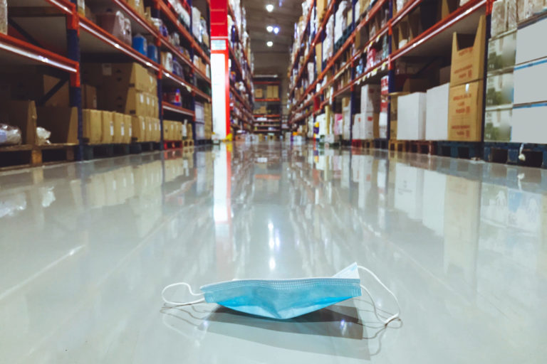 Disposable surgical mask on the floor of a supermarket