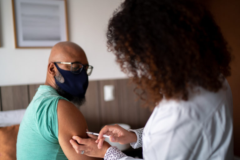 African American man getting vaccine